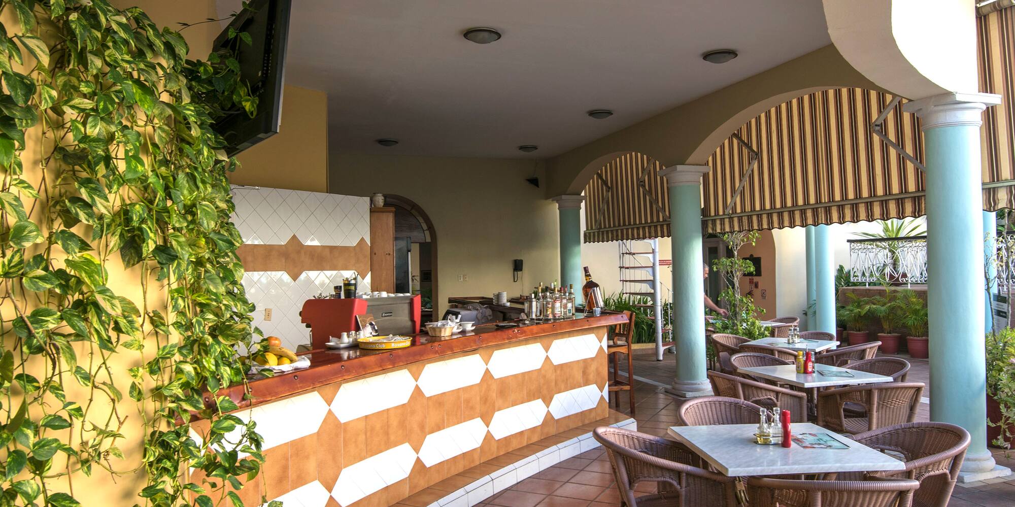 a patio with tables and chairs