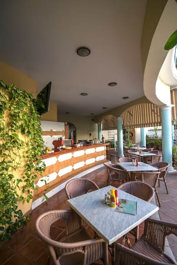 a patio with tables and chairs