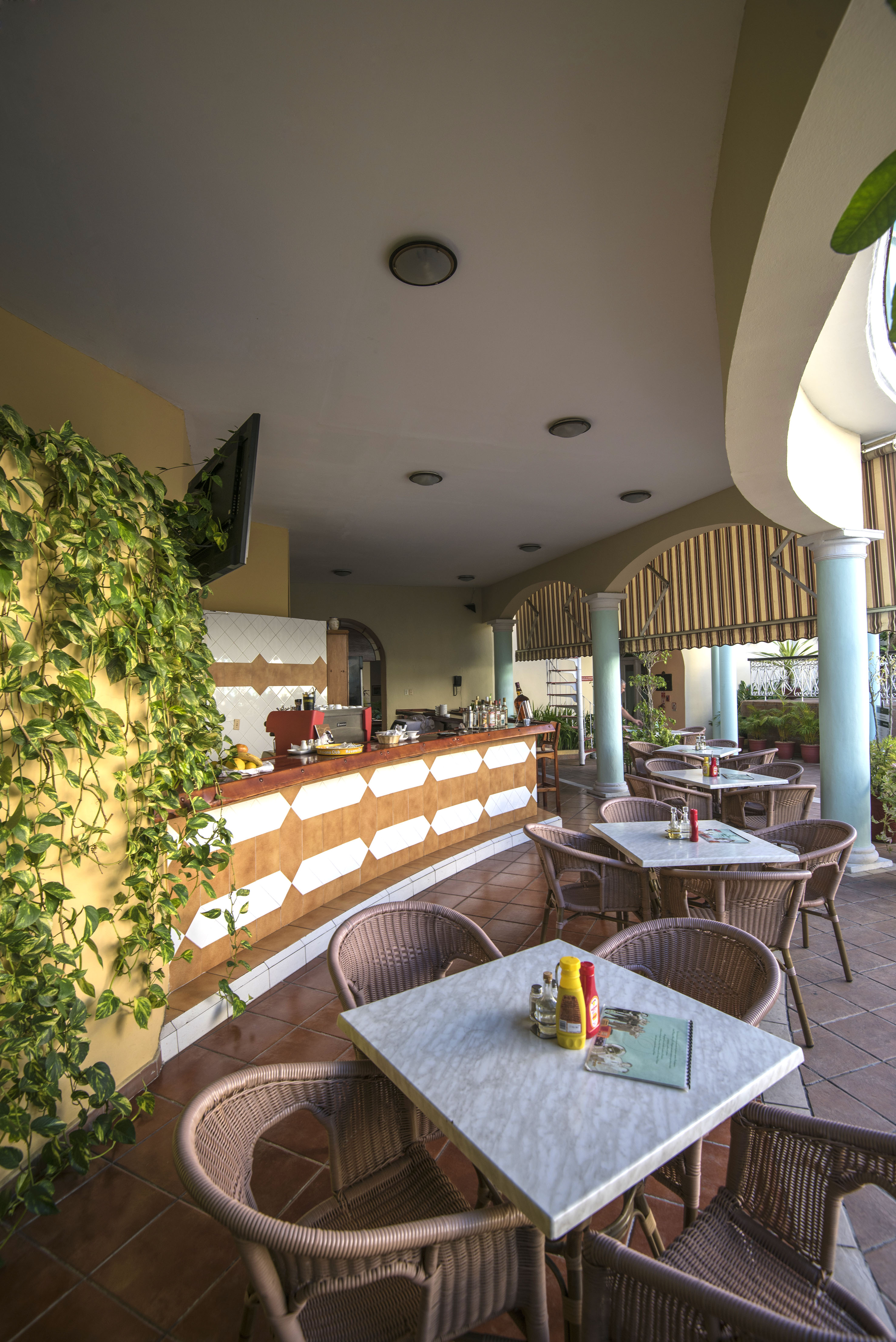 a patio with tables and chairs