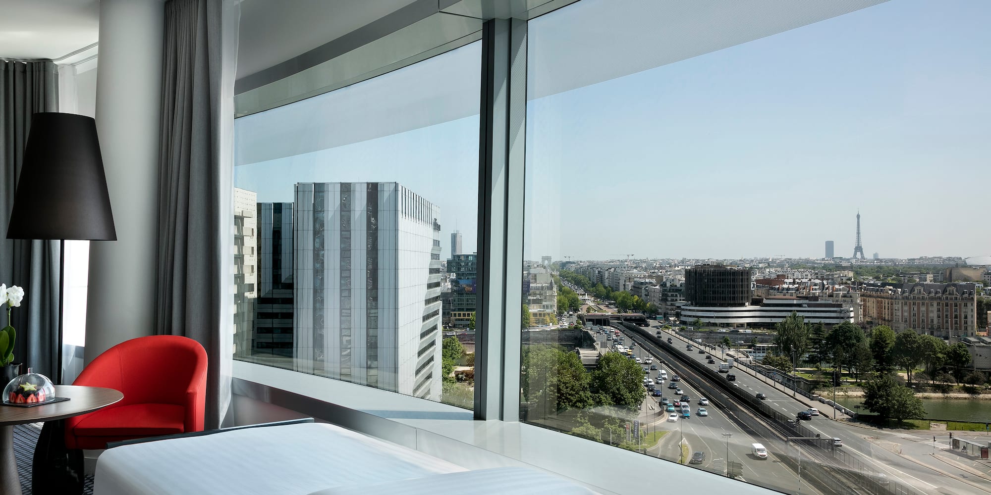 a room with a large window overlooking a city