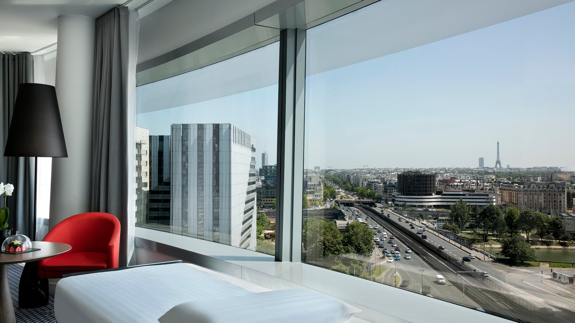 a room with a large window overlooking a city