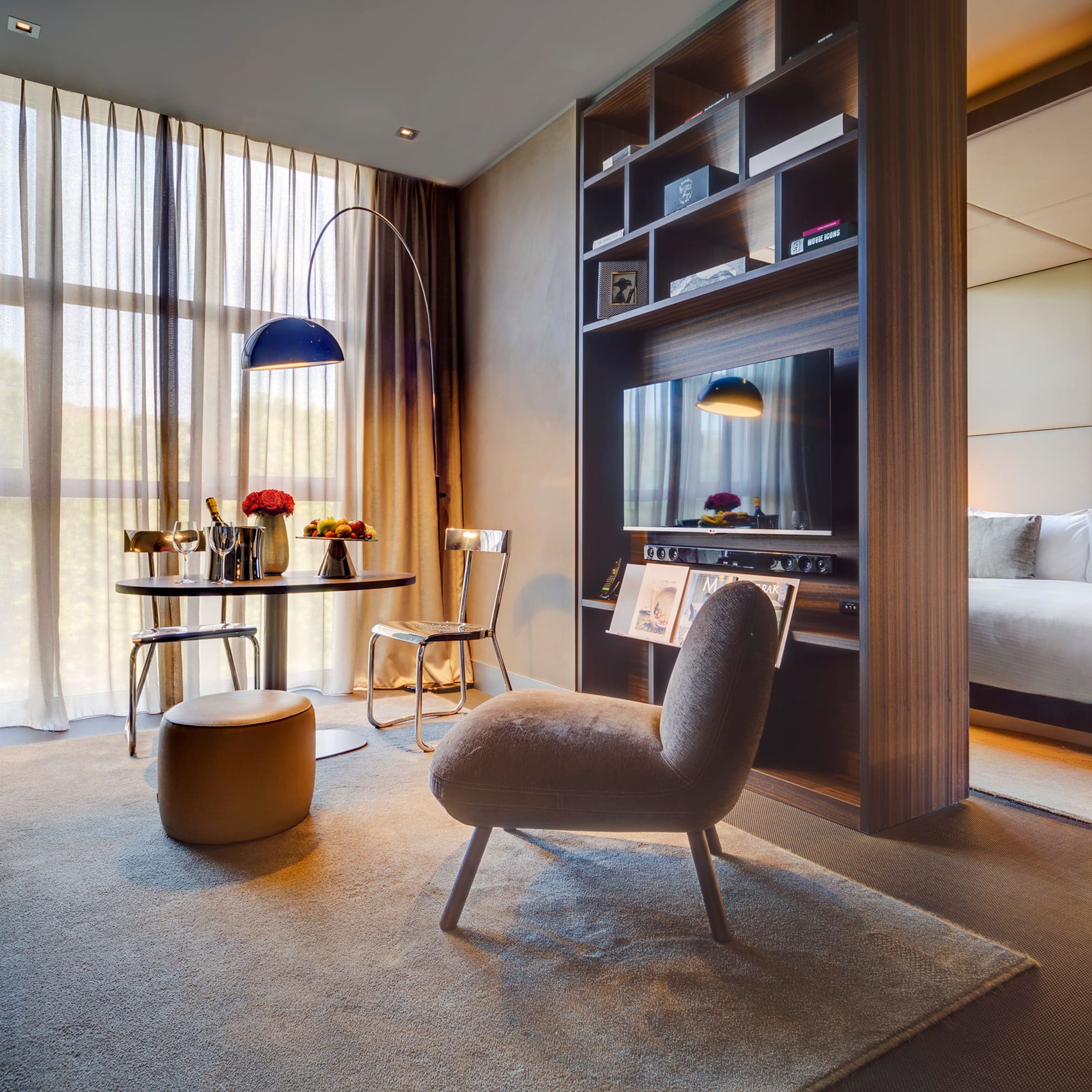 a room with a tv and a bed