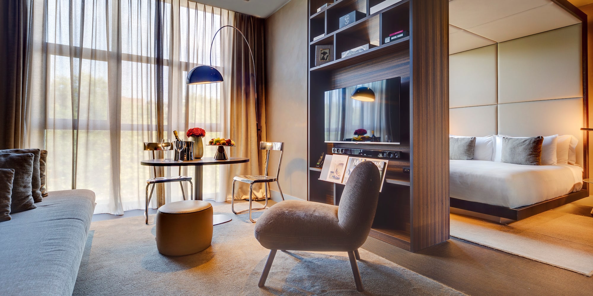 a room with a tv and a bed