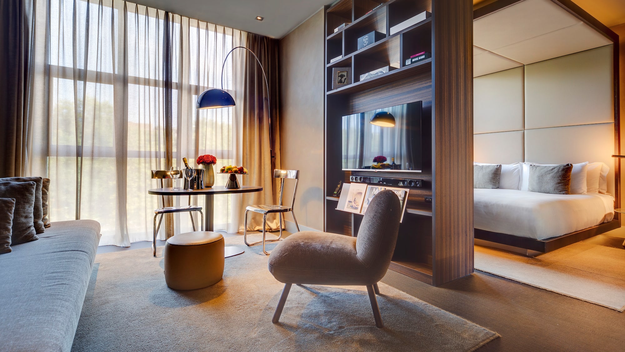 a room with a tv and a bed