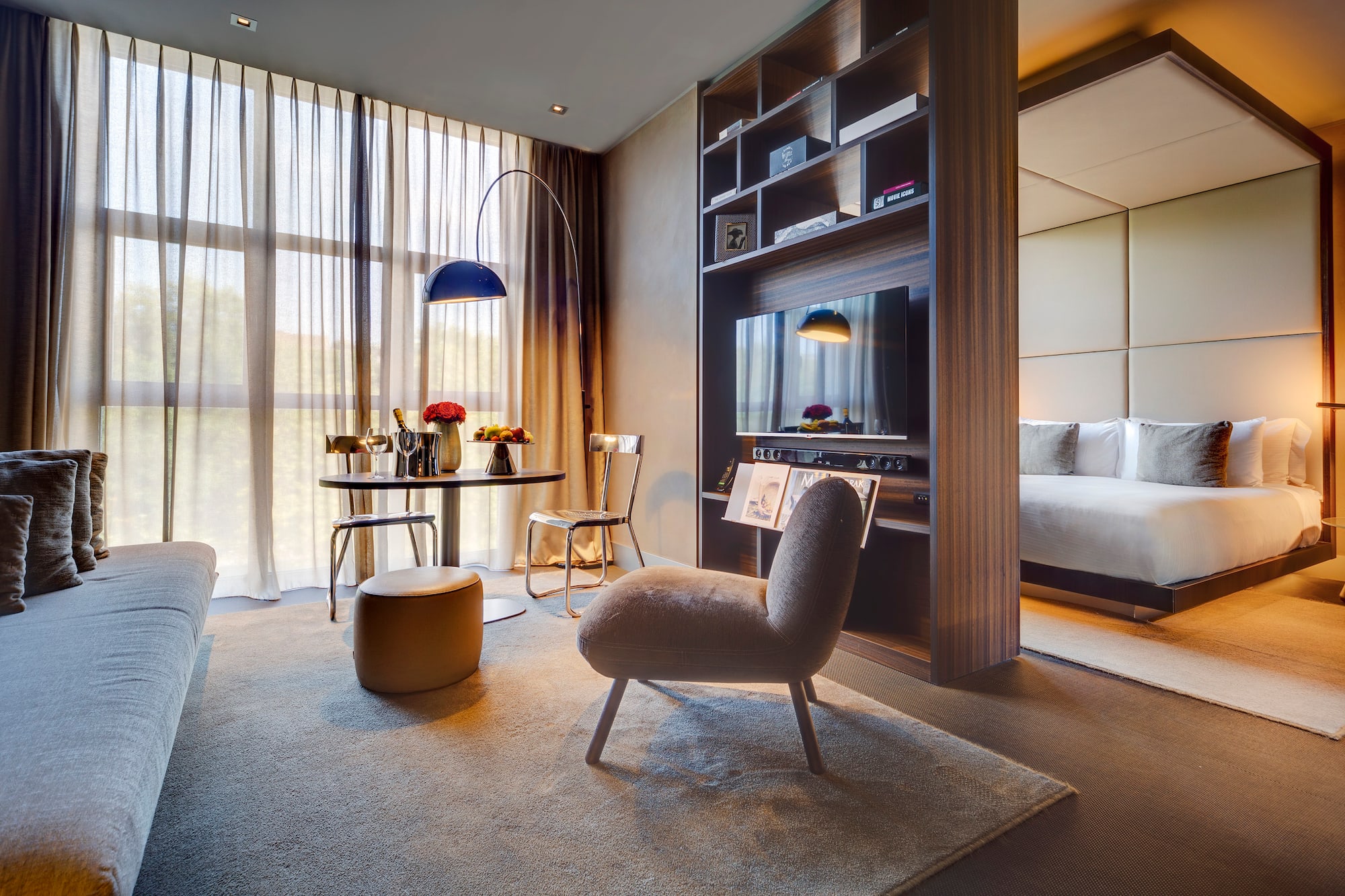 a room with a tv and a bed