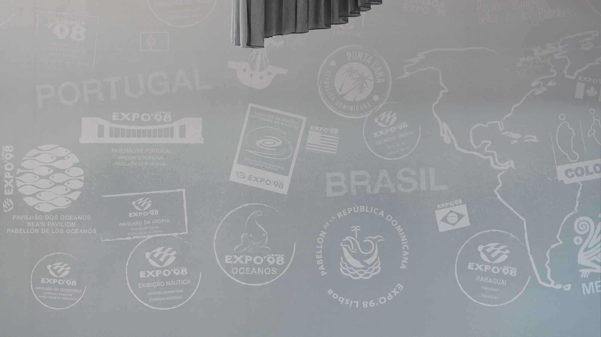 a room with a couch and chairs