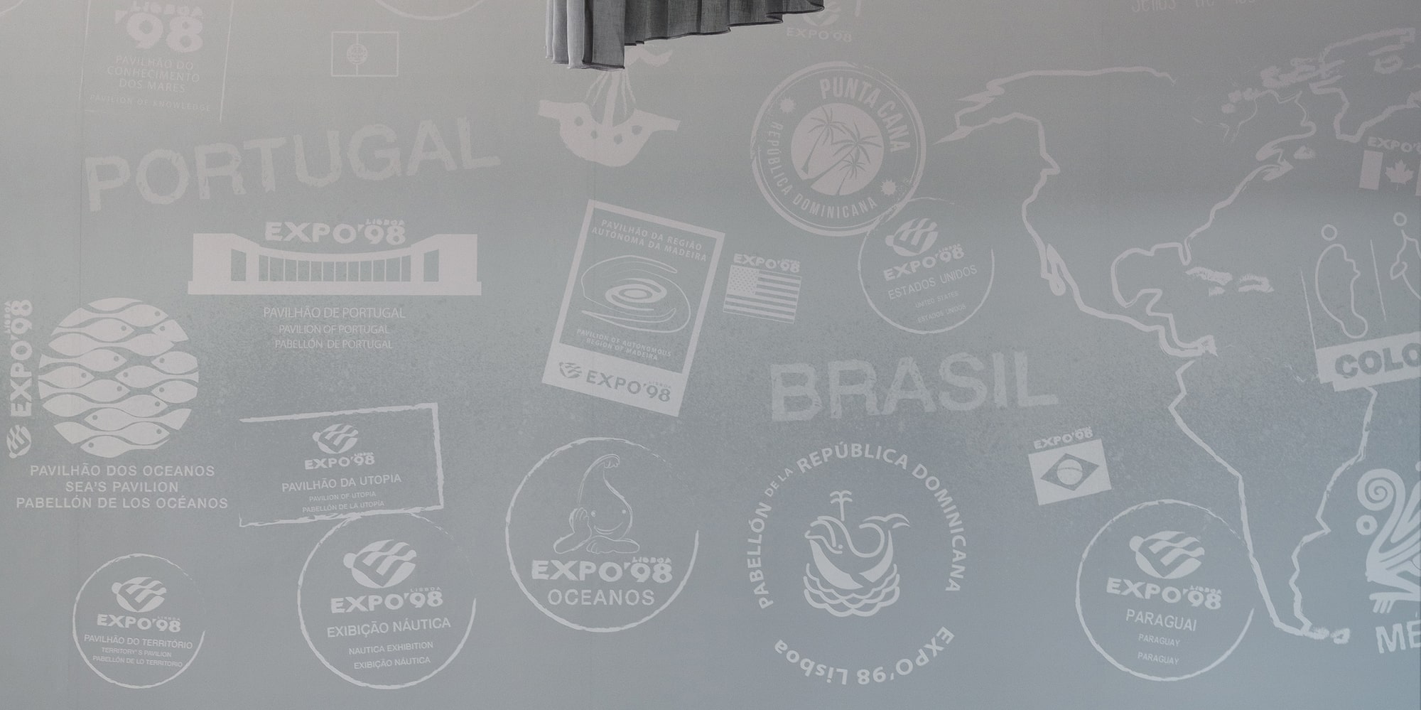 a room with a couch and chairs