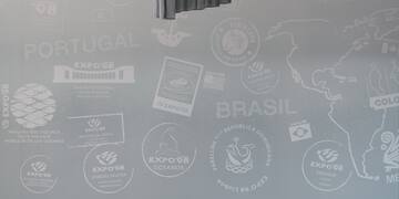 a room with a couch and chairs