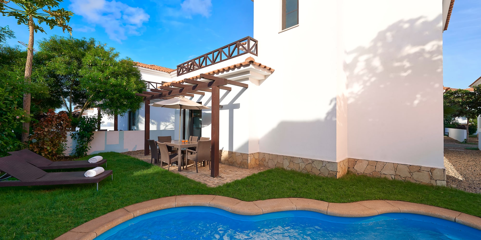 a pool in front of a house