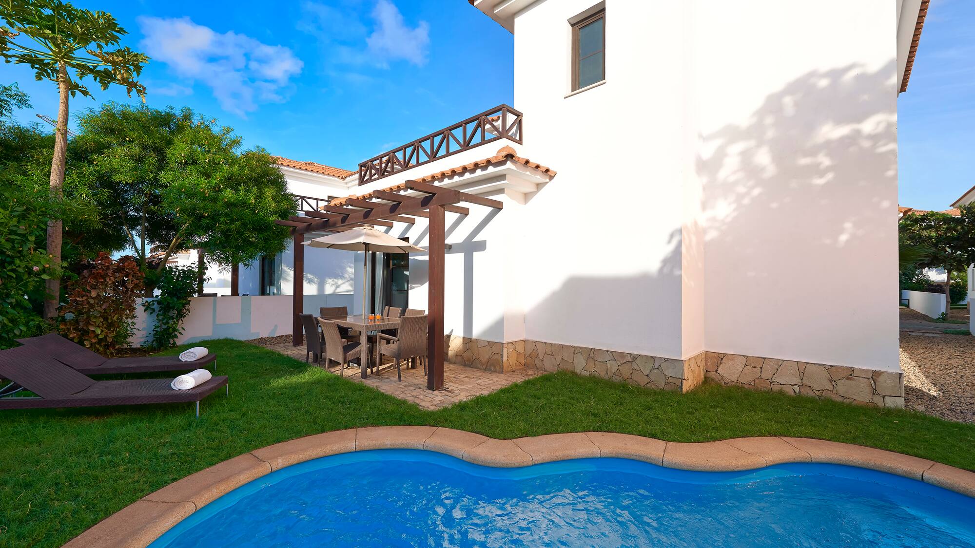 a pool in front of a house