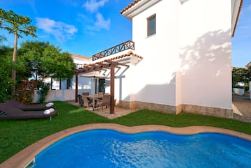 a pool in front of a house