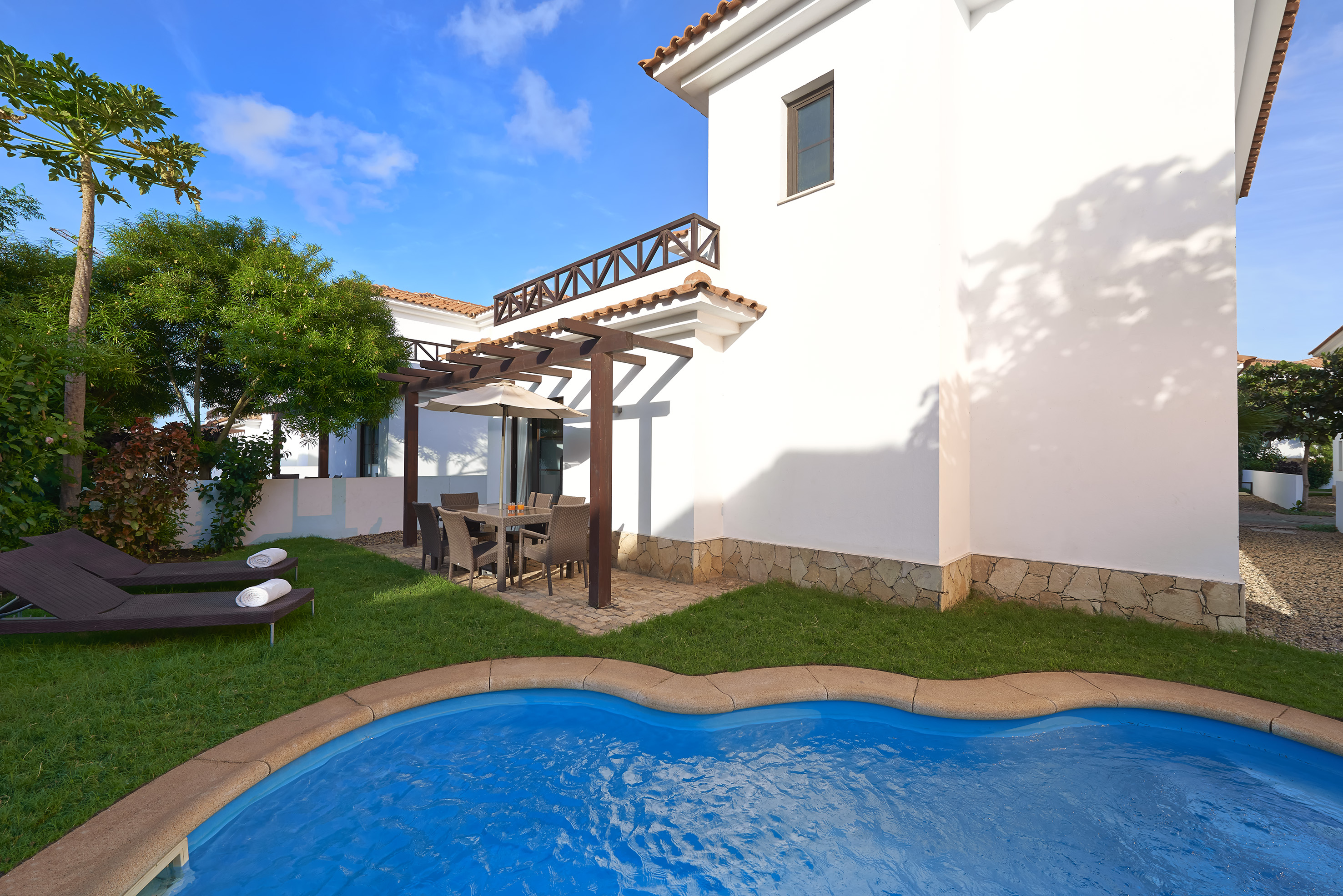 a pool in front of a house