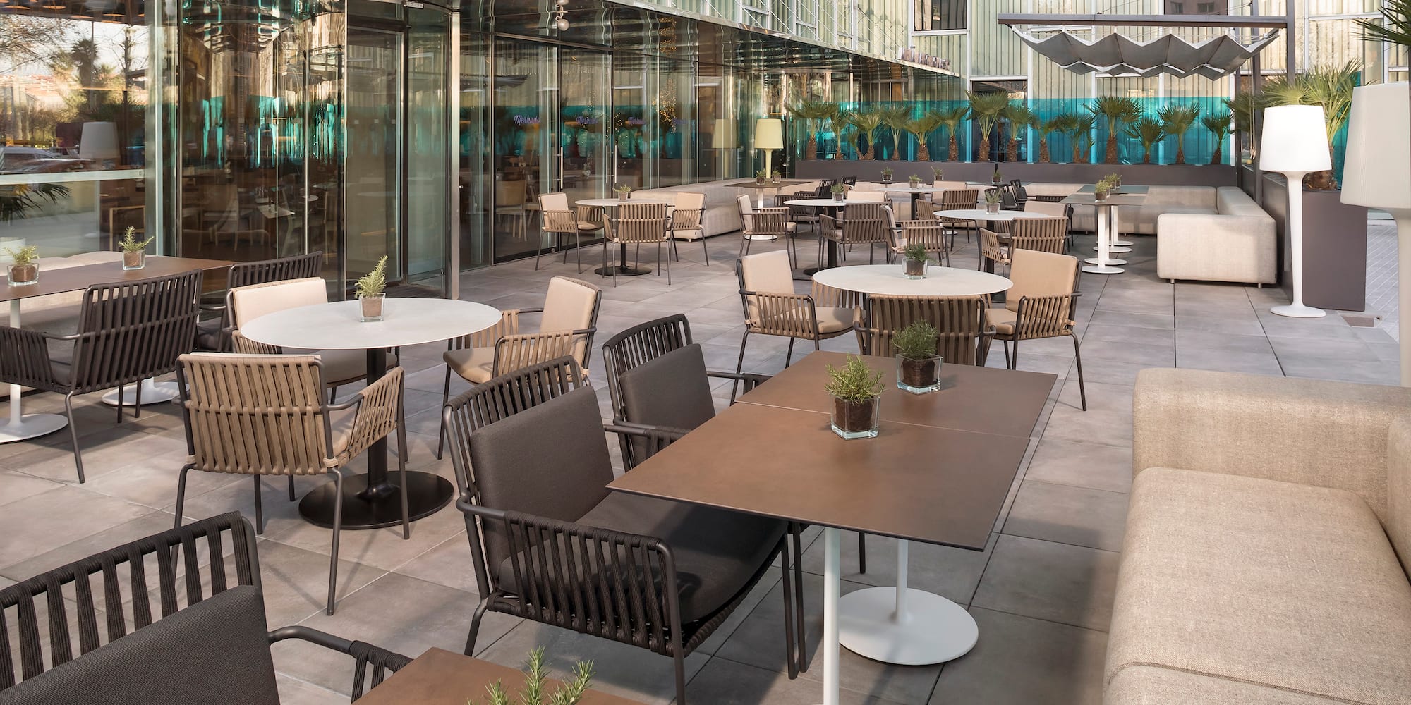 a patio with tables and chairs