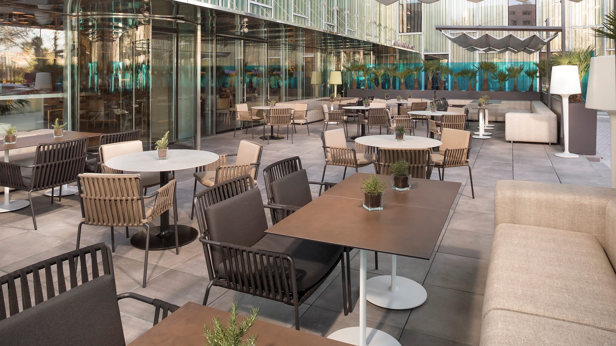 a patio with tables and chairs