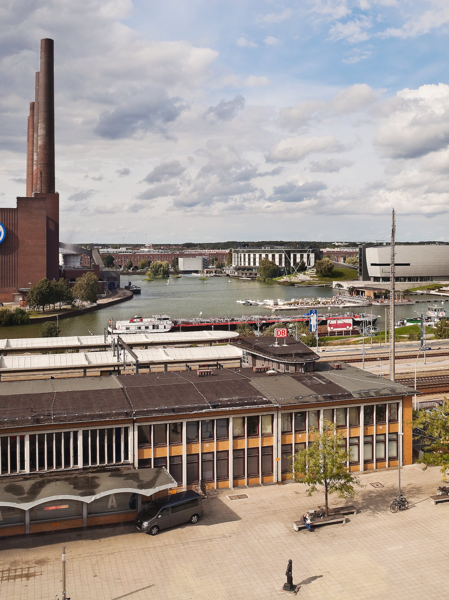 a city with a river and a factory