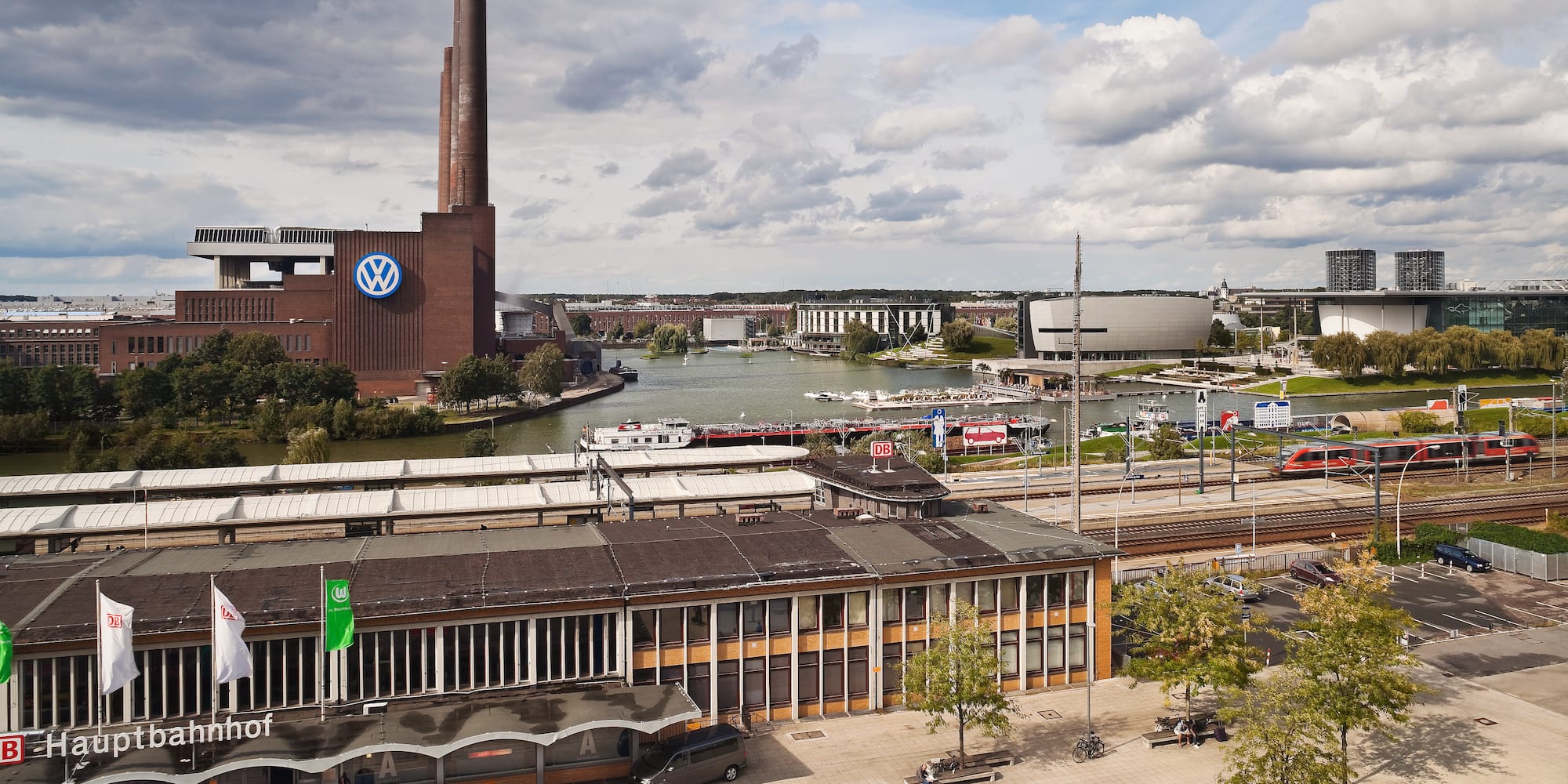 a city with a river and a factory