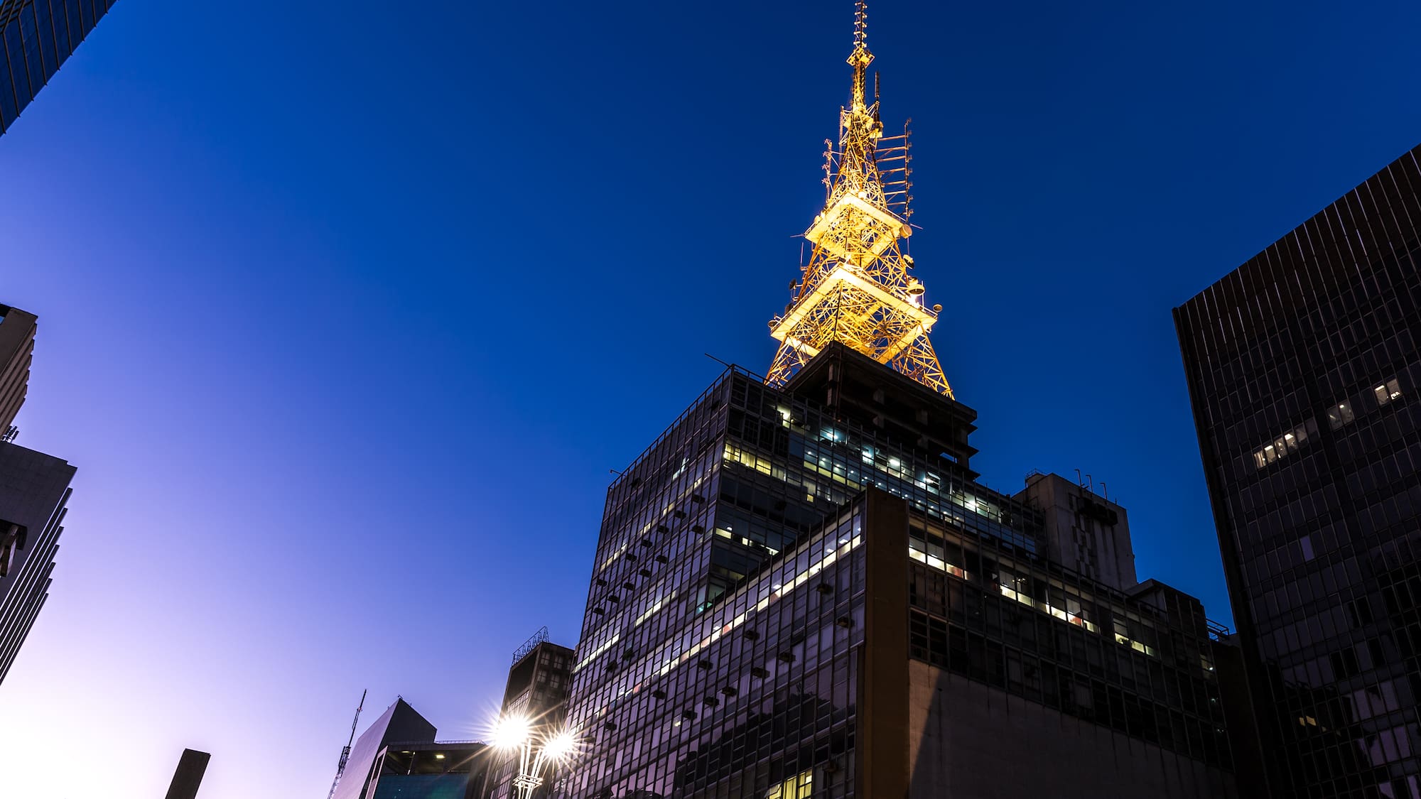 a tall building with a tower in the background
