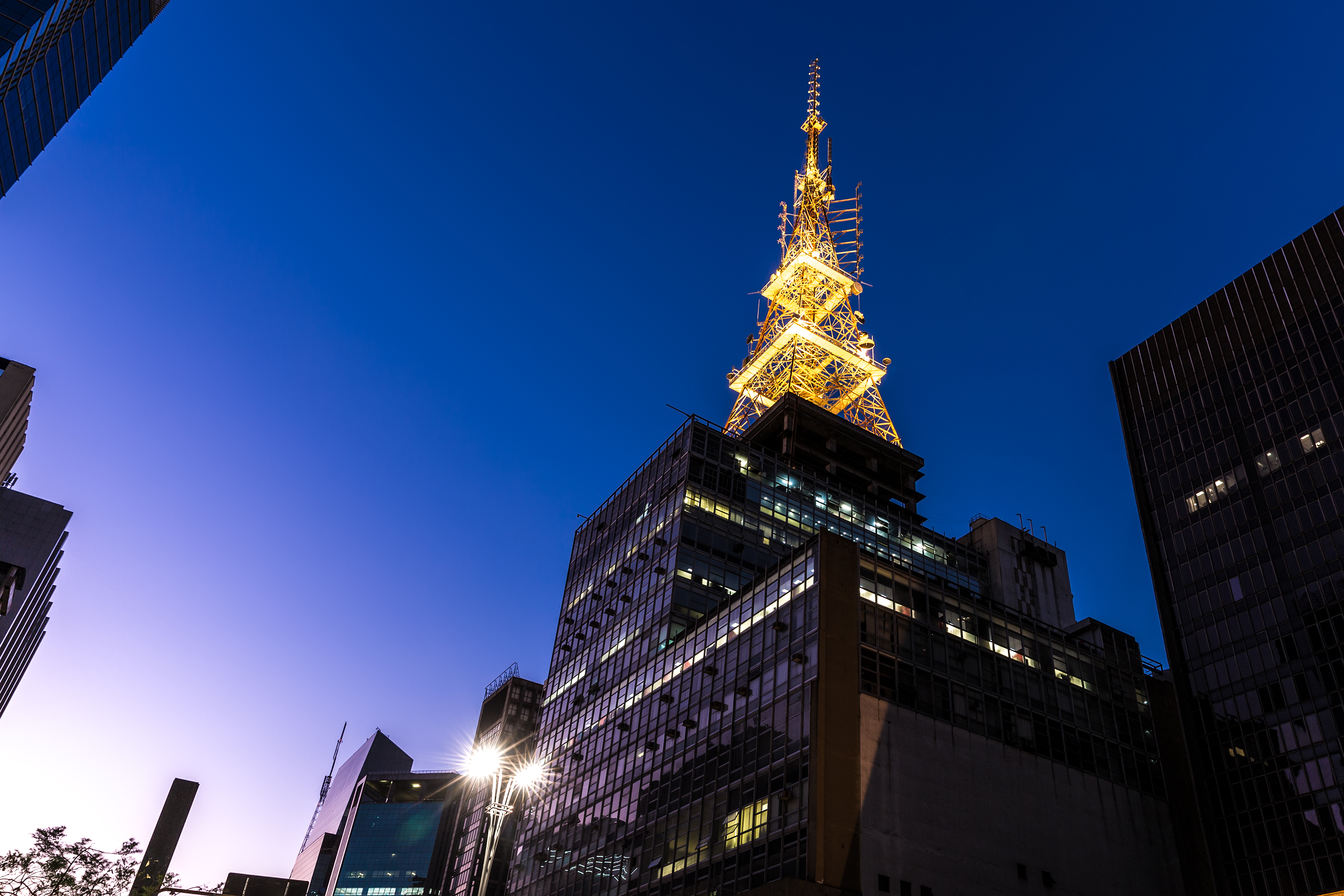 a tall building with a tower in the background