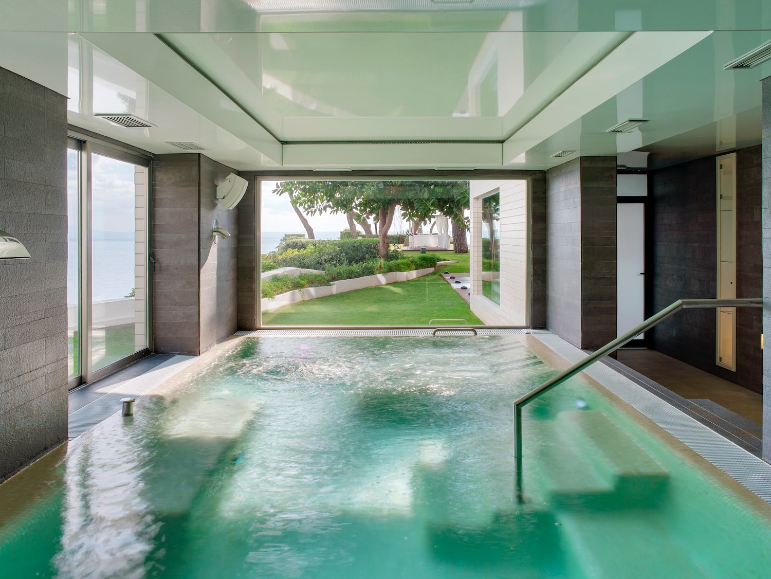 a indoor pool with a large window