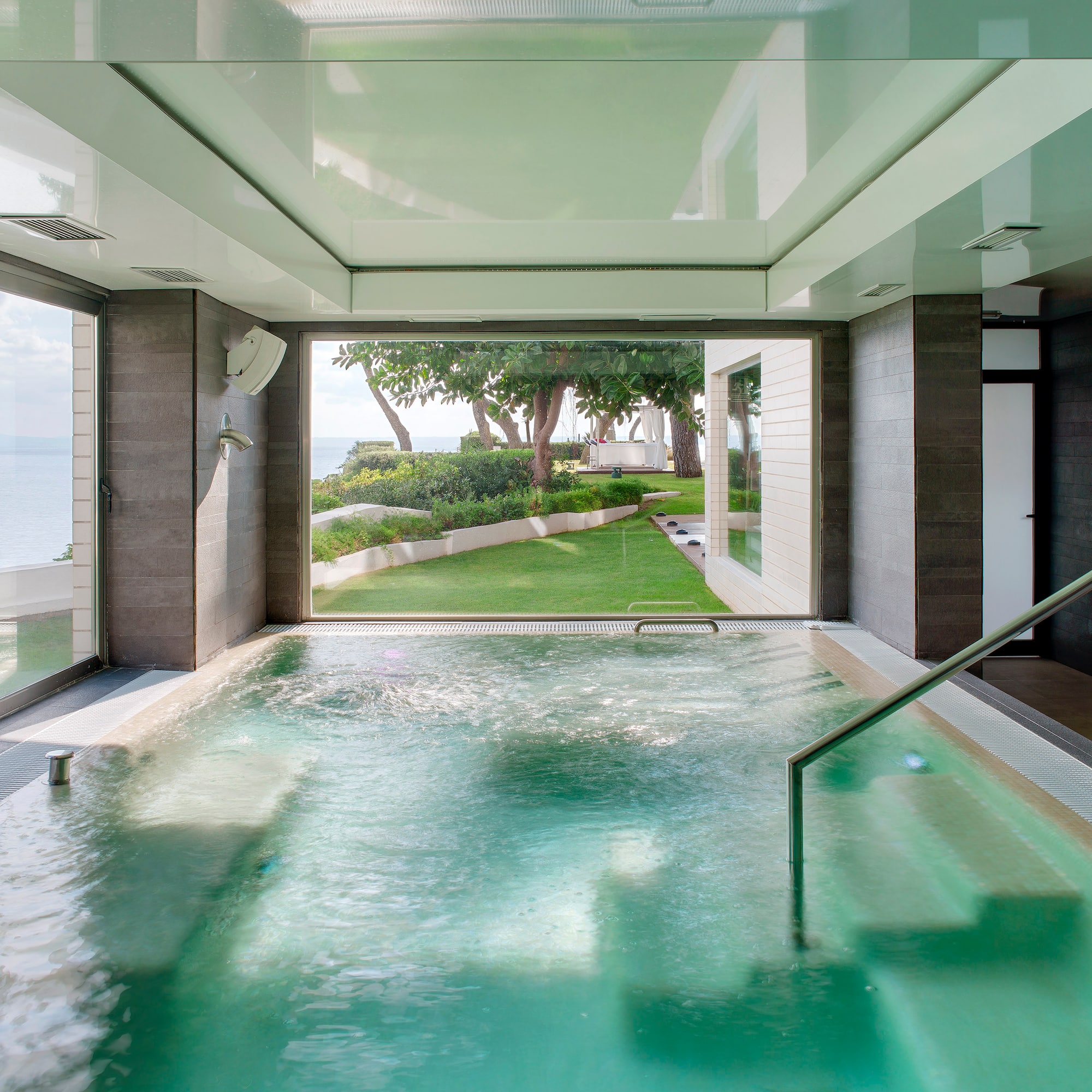 a indoor pool with a large window