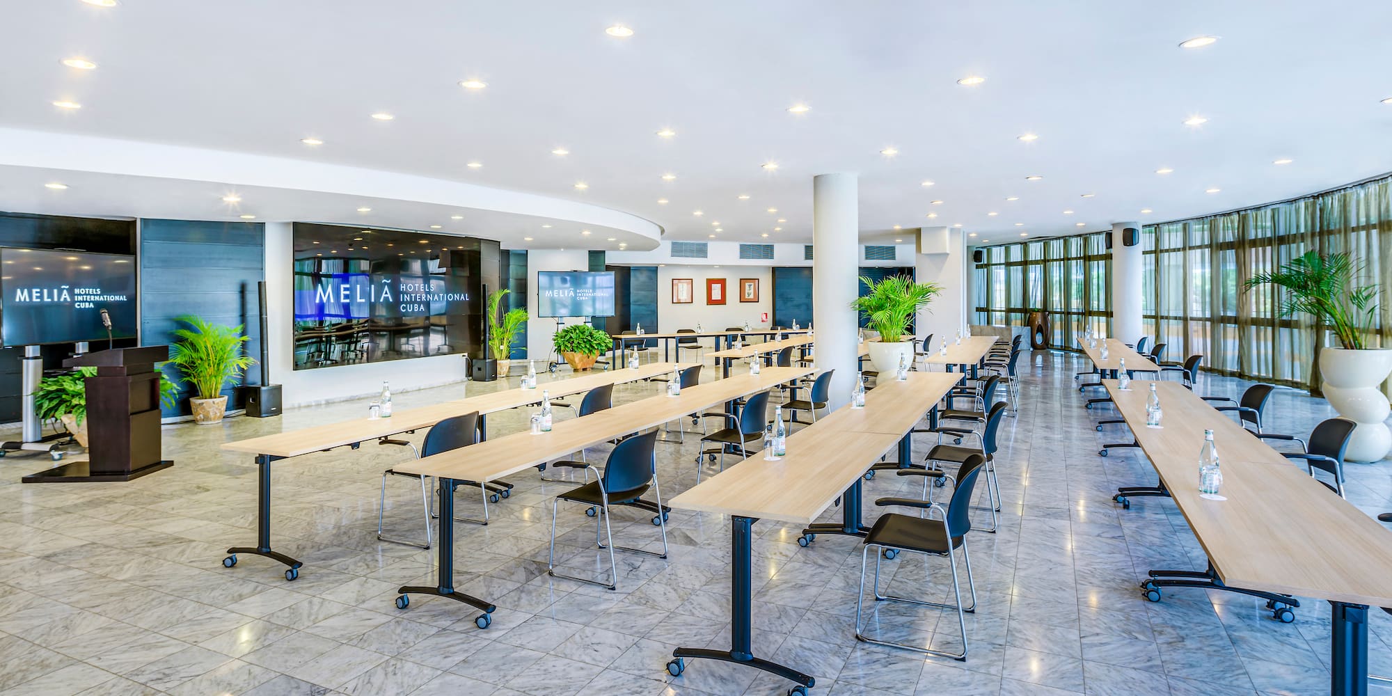 a large room with tables and chairs