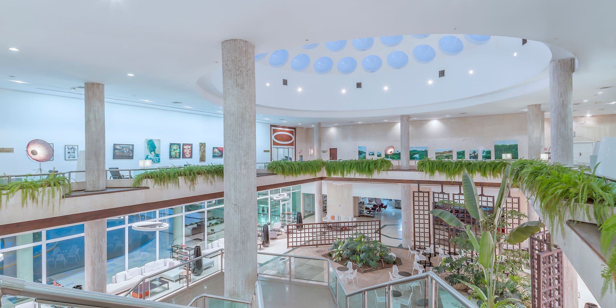 a building with a large staircase and plants