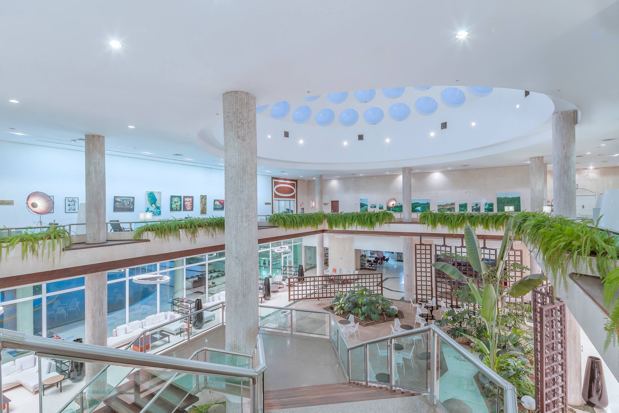 a building with a large staircase and plants