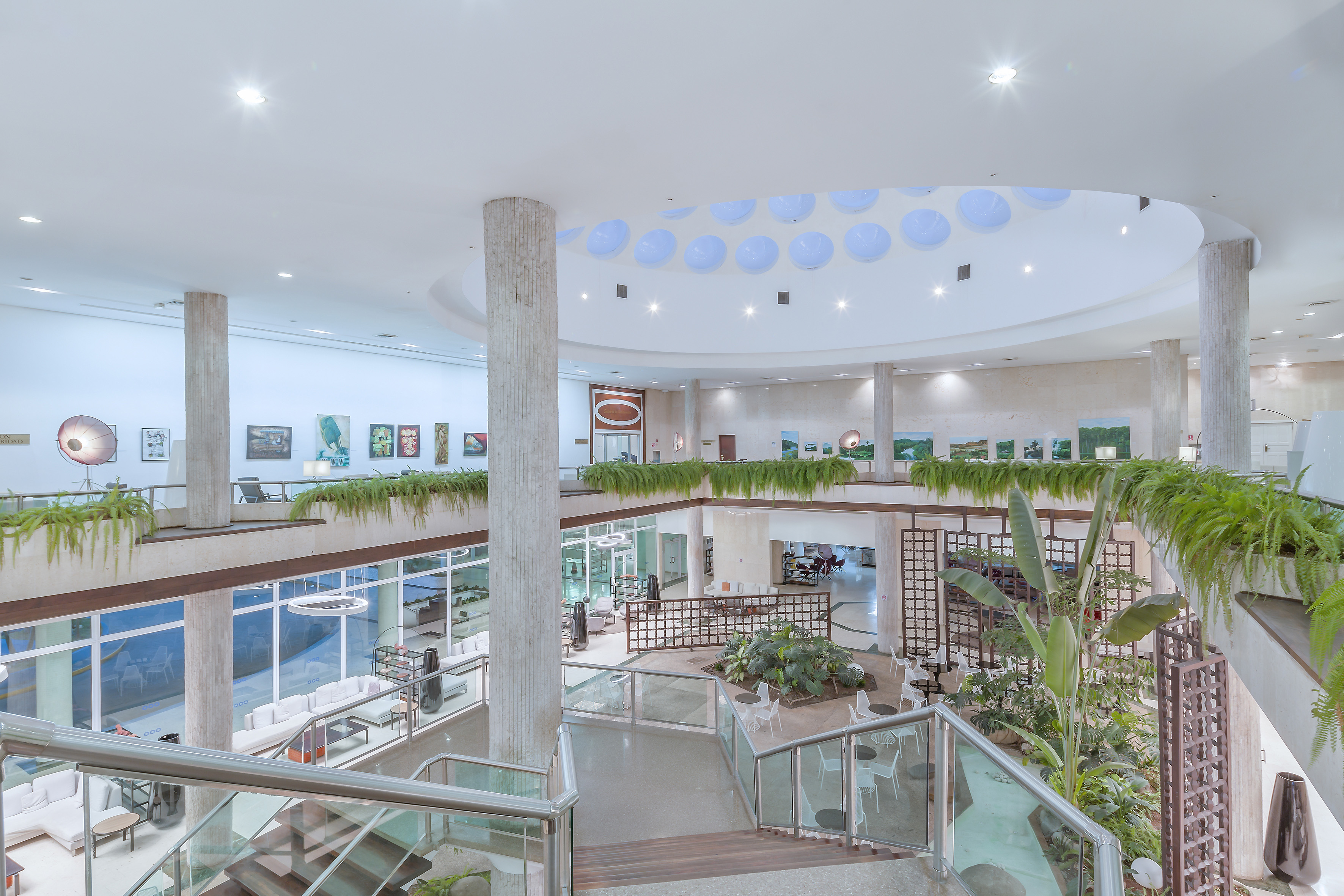 a building with a large staircase and plants
