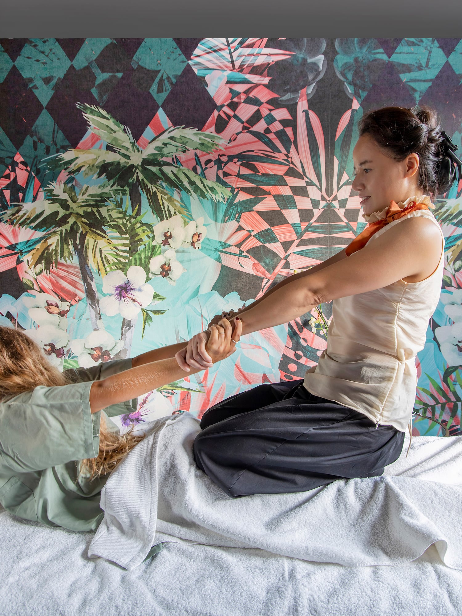 a woman holding a woman's hand