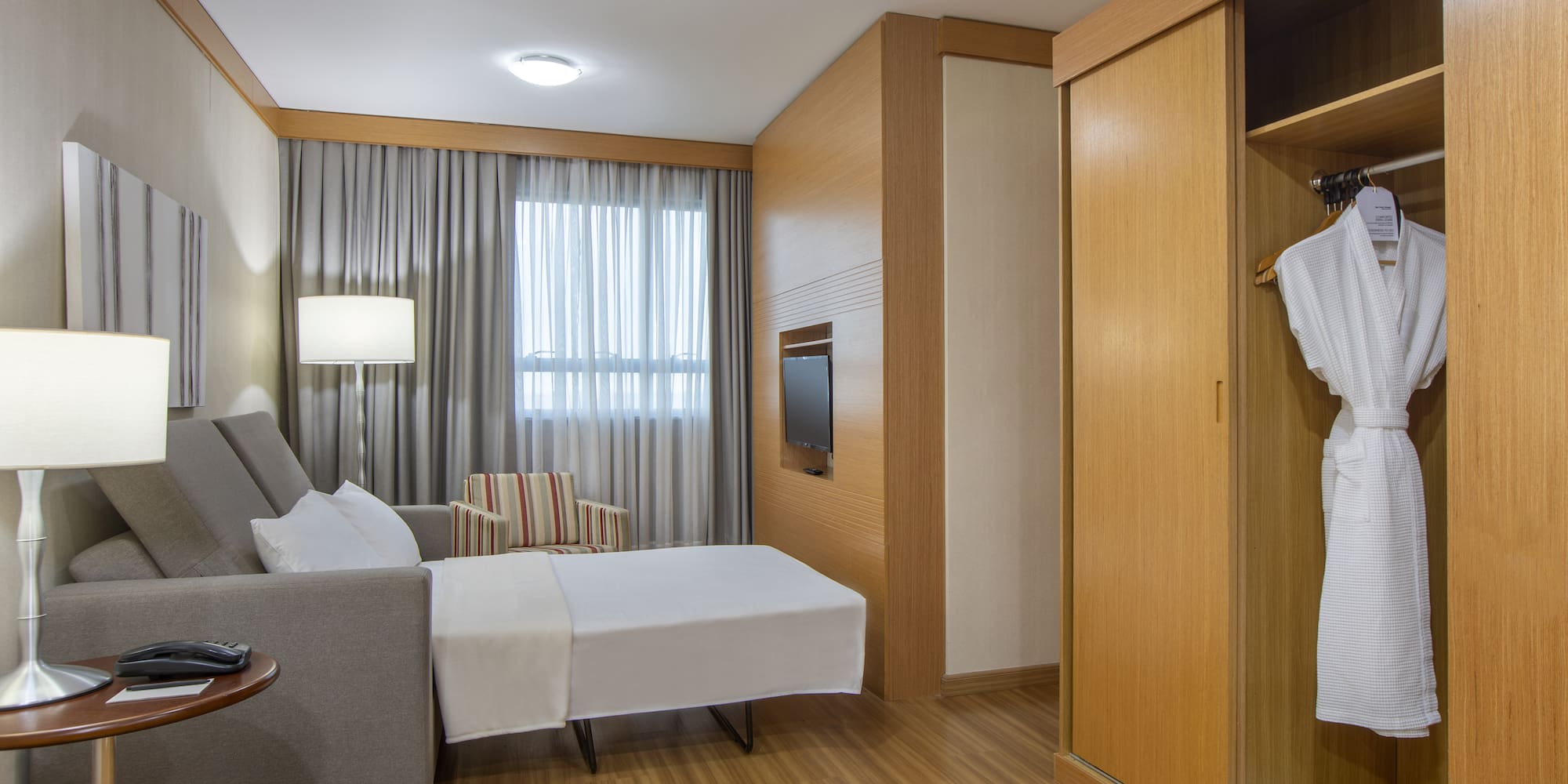 a room with a bed and a closet