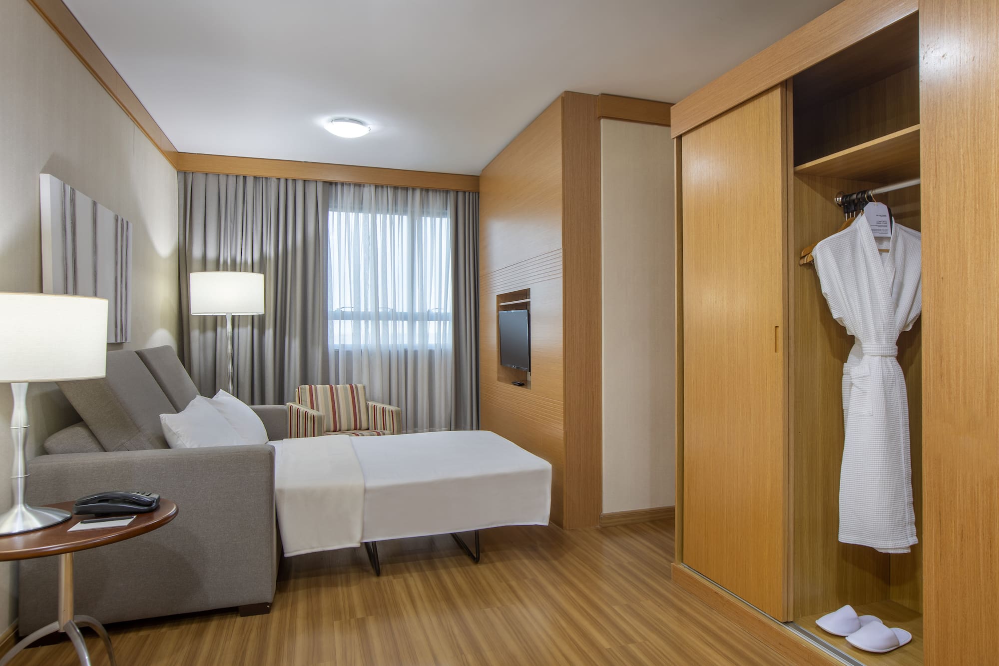 a room with a bed and a closet