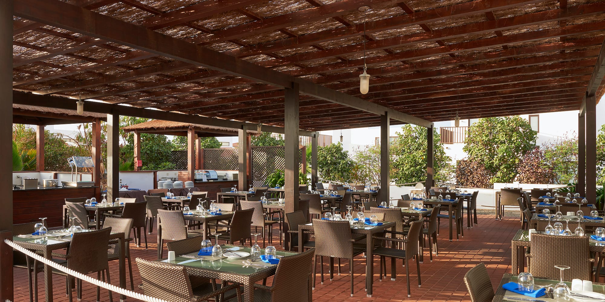 a patio with tables and chairs