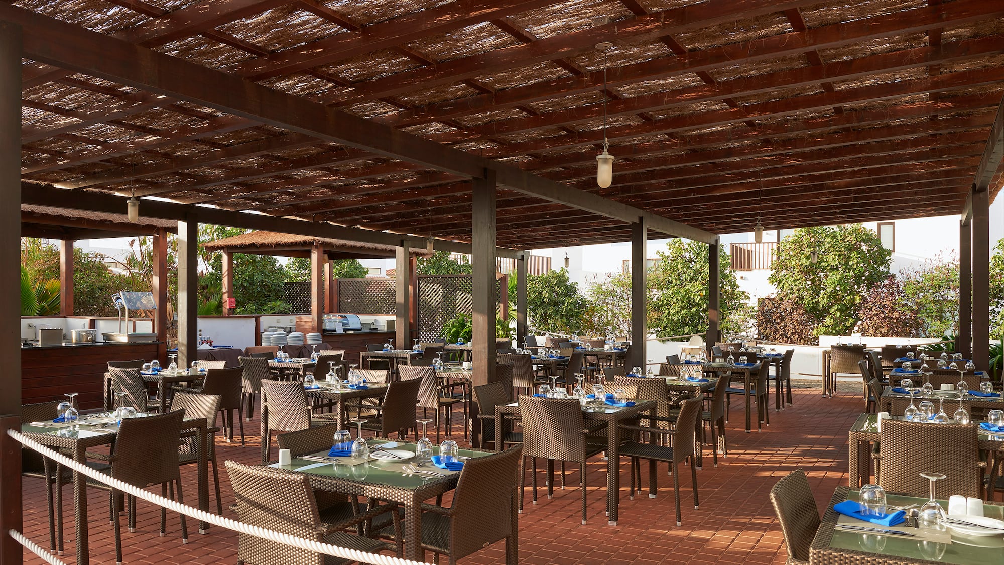 a patio with tables and chairs