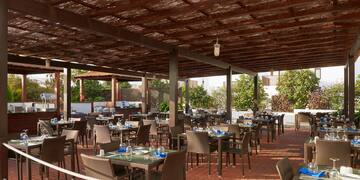 a patio with tables and chairs