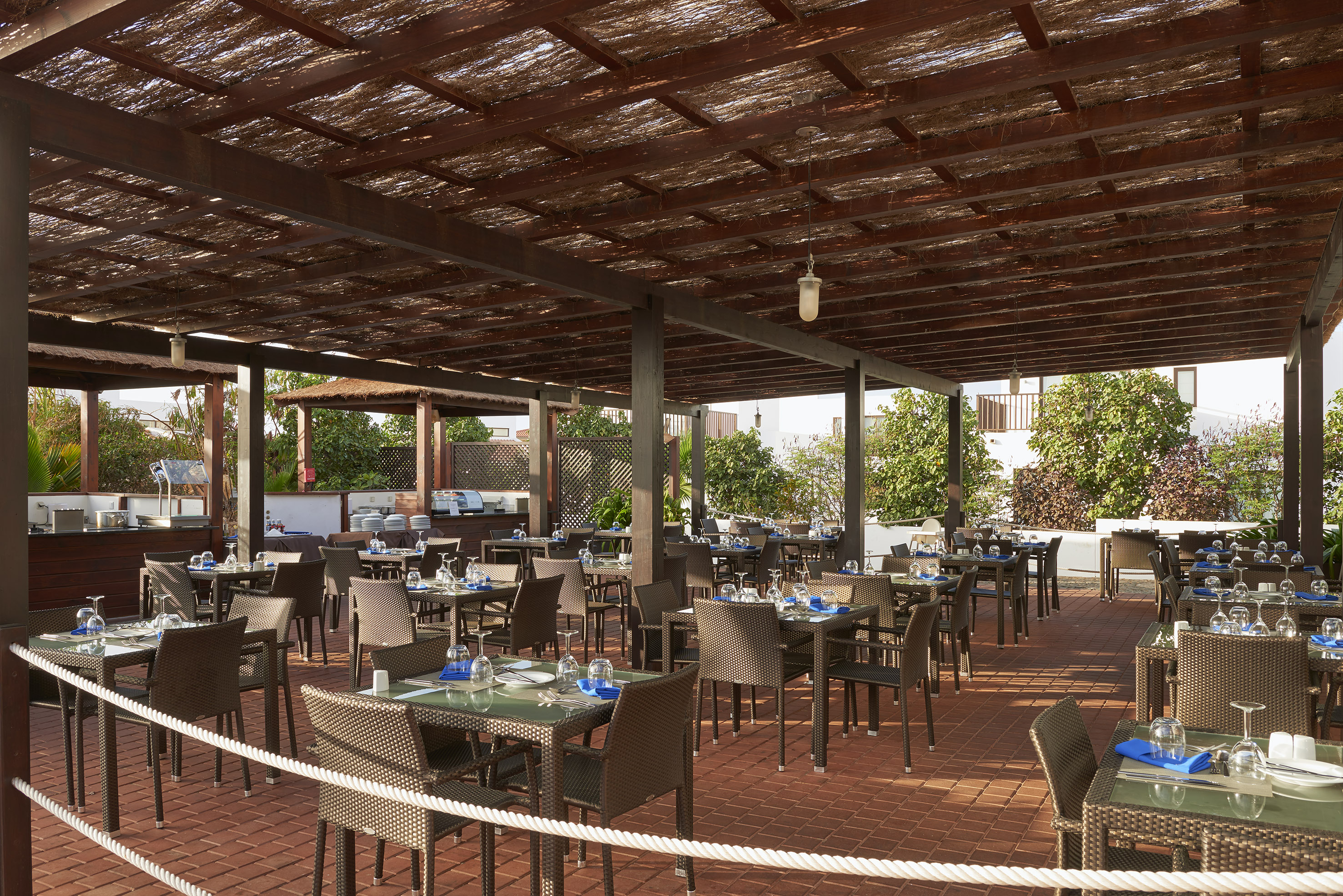 a patio with tables and chairs