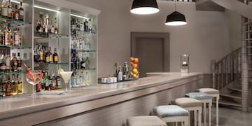 a bar with a shelf of liquor