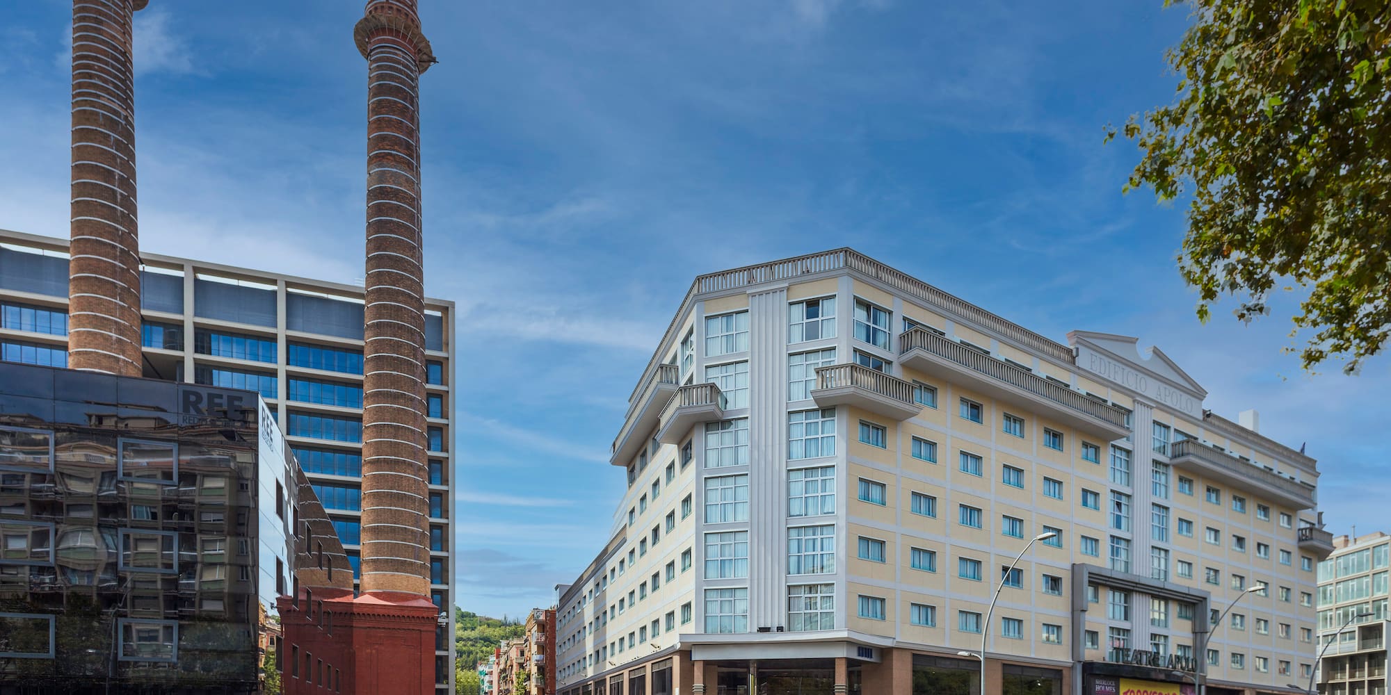 a street with buildings and a tall tower