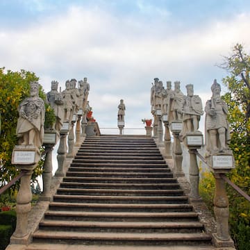 a stone staircase with statues on it
