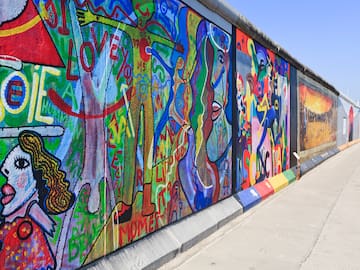 a wall with many different colors of art