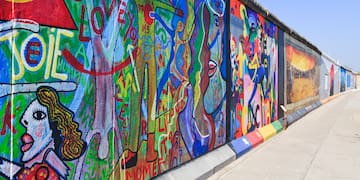 a wall with many different colors of art