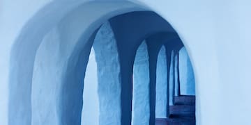 a white archways with blue arches