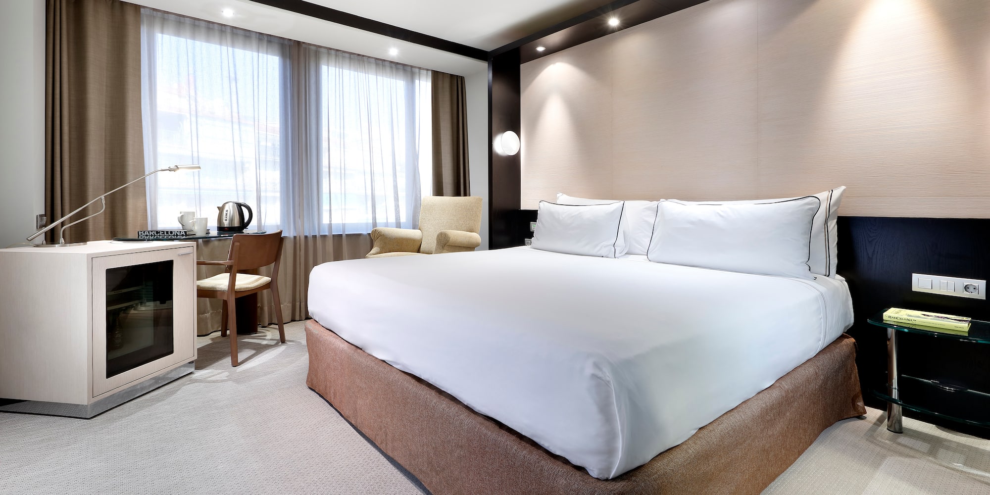 a room with a bed and a desk