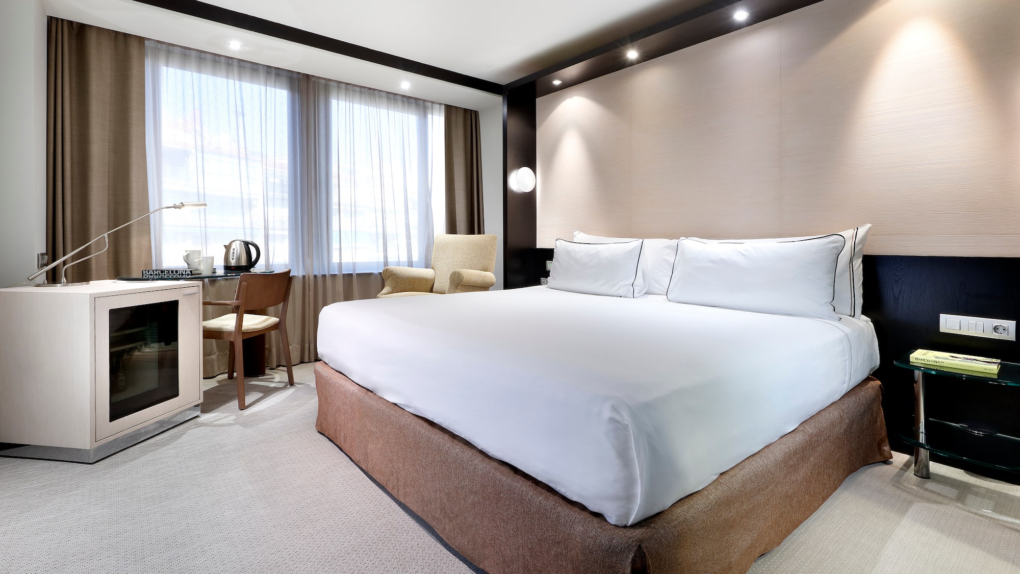 a room with a bed and a desk