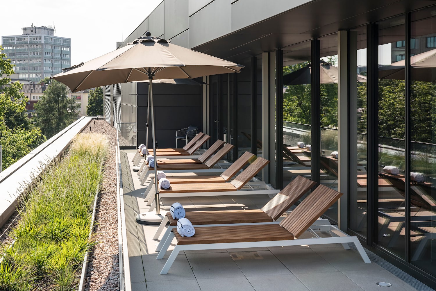 a row of chairs and umbrellas on a patio