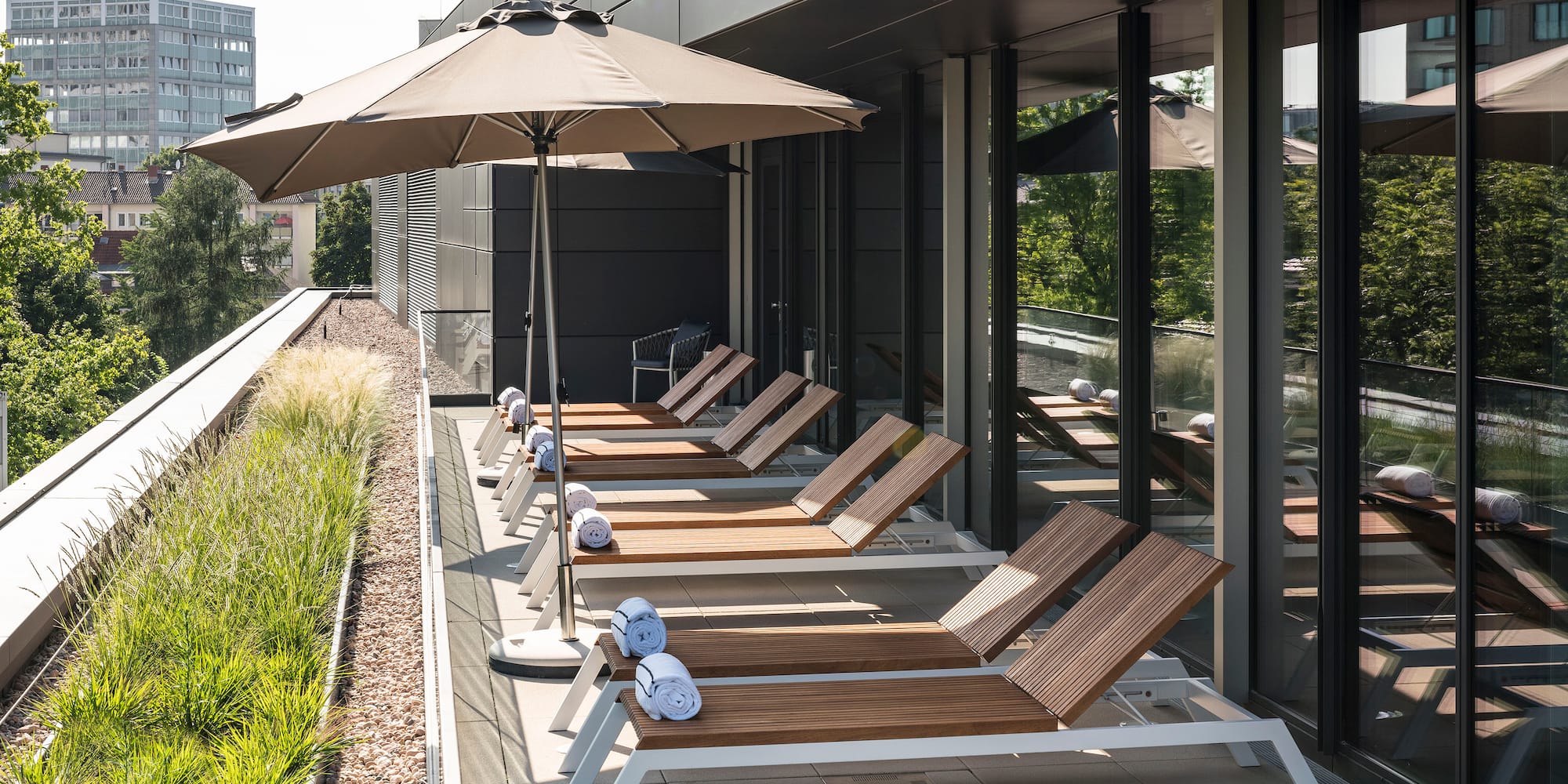 a row of chairs and umbrellas on a patio