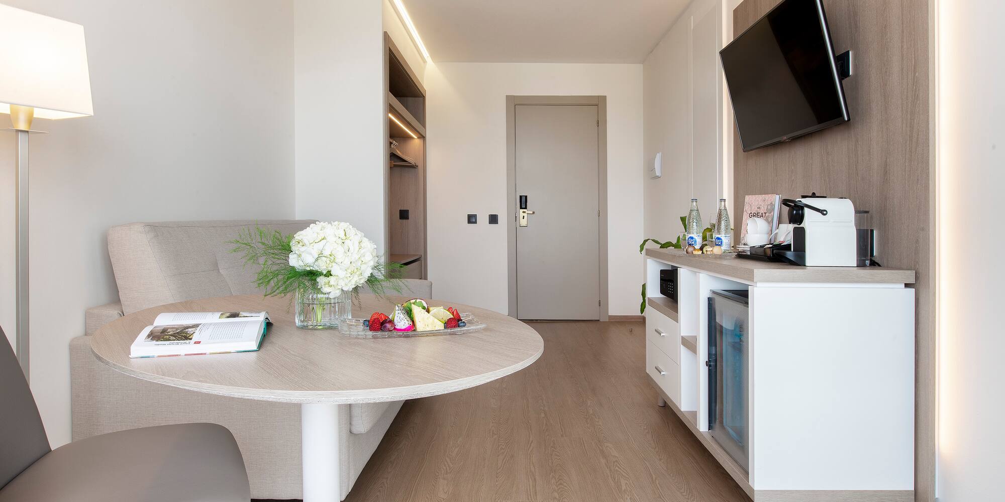 a room with a table and a television