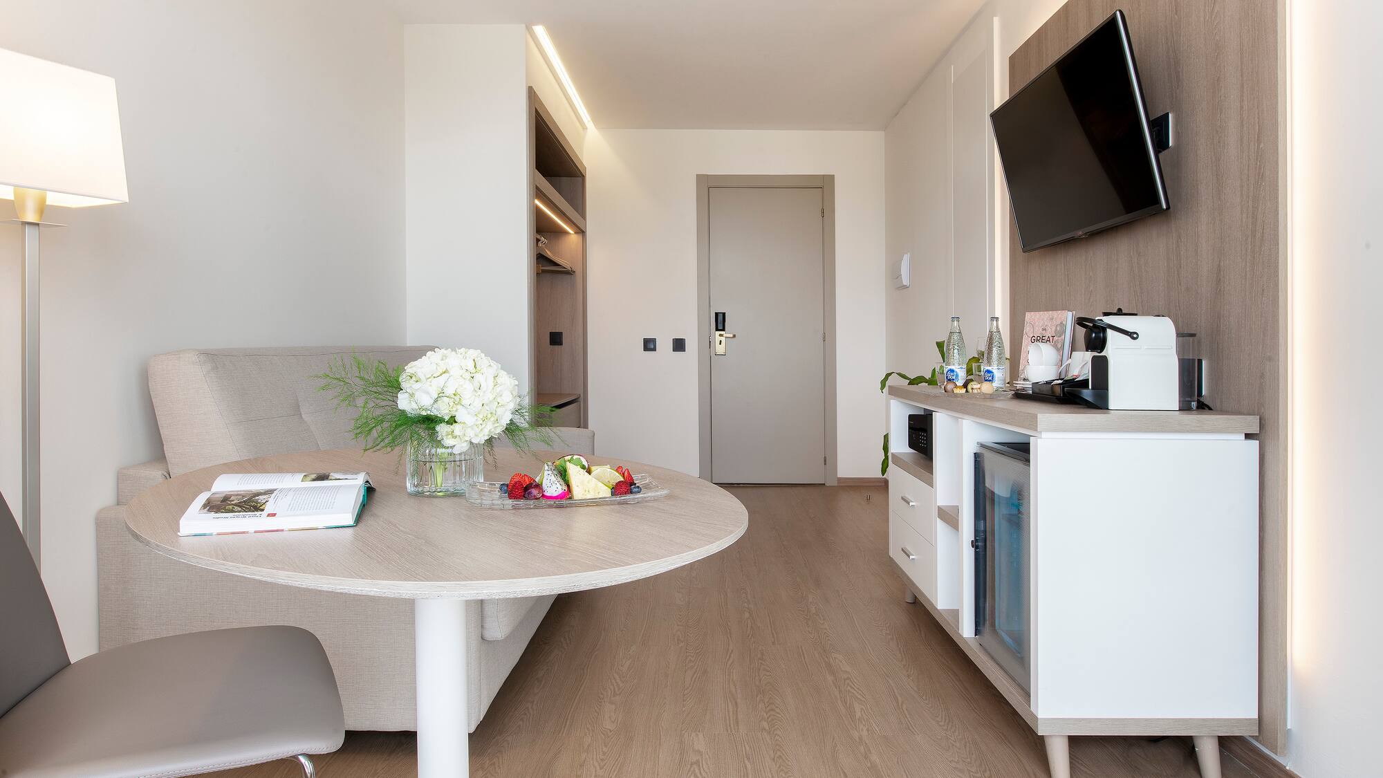 a room with a table and a television