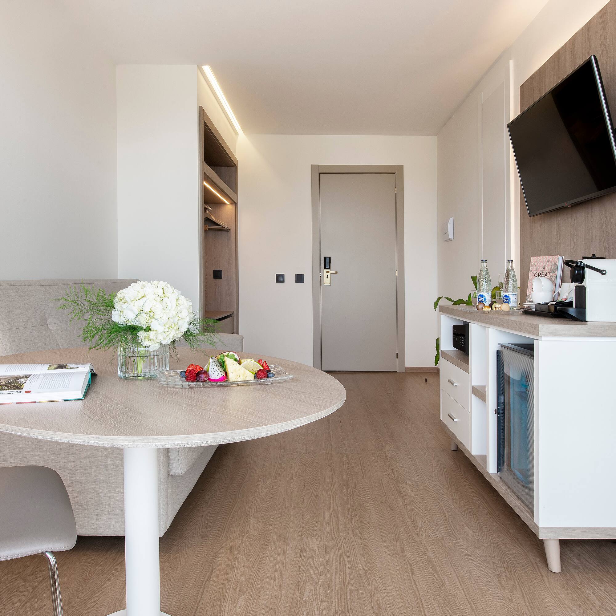 a room with a table and a television