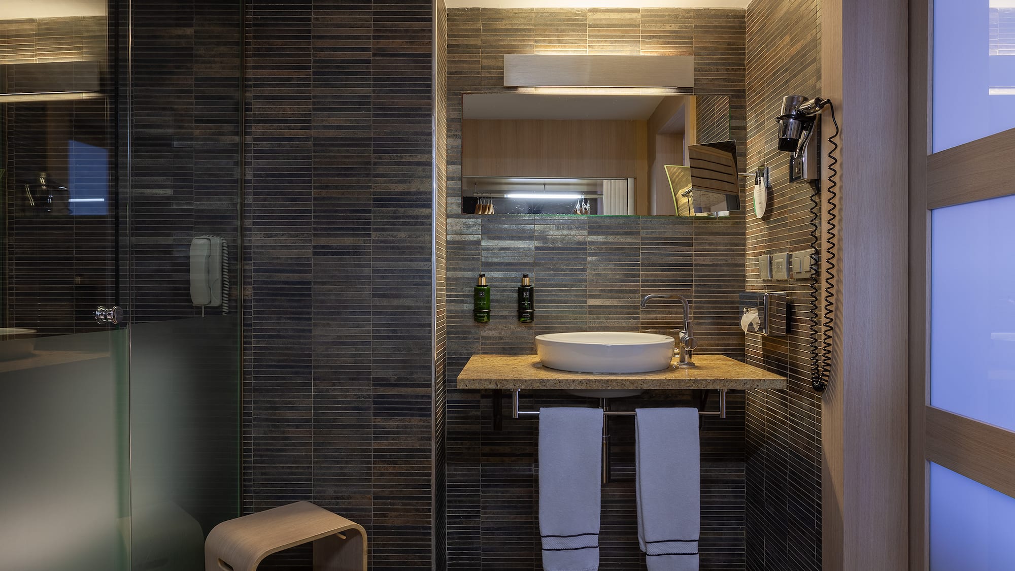 a bathroom with a sink and a shower