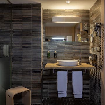 a bathroom with a sink and a shower